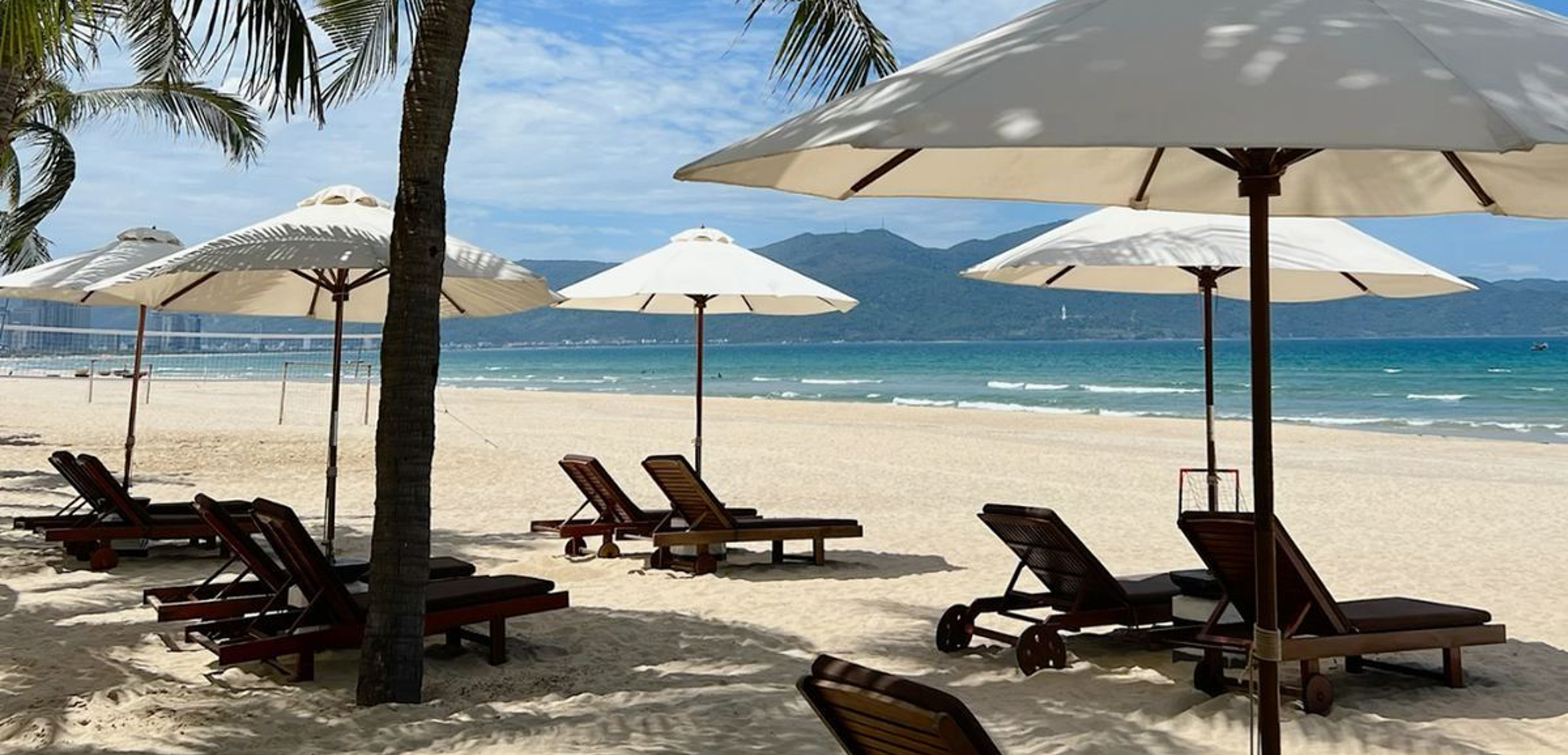 Beautiful beach in Da Nang with sun loungers and turquoise water